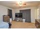 Cozy bedroom with carpet, TV, drawers, and natural light, creating a relaxing retreat at 1113 Geyser Ct, Fort Mill, SC 29715
