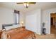 Cozy bedroom features carpet, ceiling fan, closet, and natural light from the window at 1113 Geyser Ct, Fort Mill, SC 29715