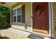 A closer view of the front door shows a decorative wreath, and a welcome mat at 1113 Geyser Ct, Fort Mill, SC 29715