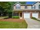 Charming townhome featuring a well-manicured front yard and attached single-car garage in a friendly community at 1113 Geyser Ct, Fort Mill, SC 29715