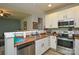Functional kitchen with stainless steel appliances, ample counter space, and white cabinets at 1113 Geyser Ct, Fort Mill, SC 29715