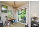 Study area with natural light, desk, and sliding glass doors leading to the patio at 1113 Geyser Ct, Fort Mill, SC 29715