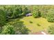 A spacious backyard with outbuilding, garden area, and a fenced perimeter at 120 Mossy Rock Trl, Iron Station, NC 28080
