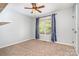 Bedroom with window, ceiling fan, and carpet at 120 Mossy Rock Trl, Iron Station, NC 28080