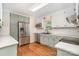 Updated kitchen boasting stainless steel appliances, hardwood floors, and white countertops at 120 Mossy Rock Trl, Iron Station, NC 28080