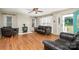 Inviting living room with fireplace, wood floors, and an abundance of natural light at 120 Mossy Rock Trl, Iron Station, NC 28080