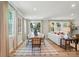 Open concept living-dining area offers expansive windows, hardwood floors and leads to a comfortable living space at 12047 Lavinia Ln, Charlotte, NC 28277