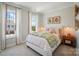 Charming bedroom with a large window, soft lighting, and floral-themed decor at 12051 Lavinia Ln, Charlotte, NC 28277