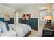 Serene bedroom showcasing two-toned walls, tasteful décor, and ample natural light at 12051 Lavinia Ln, Charlotte, NC 28277