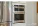Stainless steel appliances, including double ovens, in this modern kitchen at 12051 Lavinia Ln, Charlotte, NC 28277