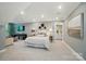 Spacious main bedroom includes a sitting area, a king bed with decorative pillows, and access to an en-suite bathroom at 12051 Lavinia Ln, Charlotte, NC 28277