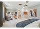 Serene bedroom includes a cozy seating area and an ensuite with an adjacent walk-in closet at 12055 Lavinia Ln, Charlotte, NC 28277