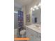 Well-lit bathroom featuring a shower-tub combo with a patterned curtain and white single sink vanity at 1260 Langston Ln, Salisbury, NC 28144