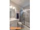 Modern bathroom with a glass-enclosed shower, white vanity, and tiled floor at 1260 Langston Ln, Salisbury, NC 28144
