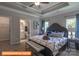 Inviting bedroom with a trey ceiling, bench at the foot of the bed, and an ensuite bathroom at 1260 Langston Ln, Salisbury, NC 28144