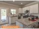 Modern kitchen featuring granite countertops, stainless steel appliances, and bright white cabinets at 1260 Langston Ln, Salisbury, NC 28144