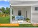 Cozy covered back patio with outdoor seating, perfect for relaxing or entertaining at 1278 Langston Ln, Salisbury, NC 28144