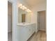 Bathroom with double sink vanity, bright lighting, and tile flooring at 1278 Langston Ln, Salisbury, NC 28144