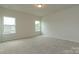 Spacious bedroom bathed in natural light from two windows, freshly painted and newly carpeted at 1278 Langston Ln, Salisbury, NC 28144