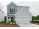 Two-story home featuring a two-car garage, vinyl siding, and manicured landscaping at 1278 Langston Ln, Salisbury, NC 28144