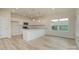 Open-concept kitchen with stainless steel appliances, white cabinets, and a large island with a sink at 1278 Langston Ln, Salisbury, NC 28144