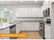 Well-lit kitchen featuring stainless appliances, ample granite countertop space, and modern fixtures at 1278 Langston Ln, Salisbury, NC 28144