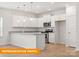 Bright kitchen featuring white cabinets, modern appliances, and a spacious island for dining at 1278 Langston Ln, Salisbury, NC 28144