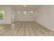 Spacious living room with wood flooring and an abundance of natural light from the large windows at 1278 Langston Ln, Salisbury, NC 28144