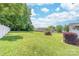Spacious backyard with large trees and lush green grass at 13223 Willow Breeze Ln, Huntersville, NC 28078