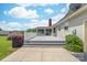 The backyard features a deck, a door to the exterior, and well-kept grass at 13223 Willow Breeze Ln, Huntersville, NC 28078