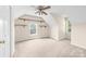 A bedroom has neutral carpet and multiple windows that bring in natural light at 13223 Willow Breeze Ln, Huntersville, NC 28078