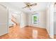 Bright dining room features hardwood floors, chair rail, and an elegant ceiling fan at 13223 Willow Breeze Ln, Huntersville, NC 28078