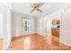 Bright dining room features hardwood floors and an open transition to the kitchen at 13223 Willow Breeze Ln, Huntersville, NC 28078