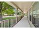 Spacious covered front porch offers great neighborhood views and natural light through windows at 13223 Willow Breeze Ln, Huntersville, NC 28078