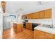 Functional kitchen with wooden cabinets, modern appliances, and a center island at 13223 Willow Breeze Ln, Huntersville, NC 28078