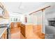 Spacious kitchen with wooden cabinets, an island, and stainless steel appliances at 13223 Willow Breeze Ln, Huntersville, NC 28078