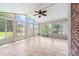 Bright sunroom with lots of windows, vaulted ceiling, and fan. Great spot for relaxing at 13223 Willow Breeze Ln, Huntersville, NC 28078