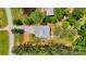 Aerial view of a property surrounded by lush trees and featuring a long driveway at 1406 High Shoals Rd, Lincolnton, NC 28092