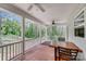 Relaxing covered porch with ceiling fans, perfect for outdoor dining and enjoying the serene surroundings at 1406 High Shoals Rd, Lincolnton, NC 28092
