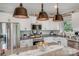 Modern kitchen with stainless steel appliances, granite countertops, and stylish pendant lighting at 1406 High Shoals Rd, Lincolnton, NC 28092
