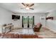 Inviting living room featuring wood-look floors, a ceiling fan, and a comfortable seating area at 1406 High Shoals Rd, Lincolnton, NC 28092