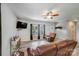 Bright living room with a ceiling fan, wood-look flooring, and ample natural light at 1406 High Shoals Rd, Lincolnton, NC 28092
