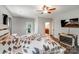 Bedroom with hardwood floors, barn door, and access to bathroom at 1406 High Shoals Rd, Lincolnton, NC 28092