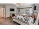 Bedroom with barn door, ceiling fan, and TV at 1406 High Shoals Rd, Lincolnton, NC 28092