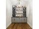 Charming bar with custom cabinets, perfect for showcasing a wine collection and entertaining in style at 14228 Ryker Way, Davidson, NC 28036