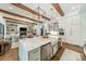 Spacious kitchen features a large marble island, modern lighting, and an open layout to the living area at 14228 Ryker Way, Davidson, NC 28036