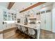 This open kitchen boasts an expansive marble island, stainless appliances and modern fixtures at 14228 Ryker Way, Davidson, NC 28036