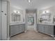 Luxurious bathroom with double vanity sinks and modern lighting at 148 Spring Grove Dr, Mooresville, NC 28117