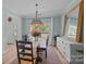 Charming dining room with natural light, a rustic table, and elegant decor at 148 Spring Grove Dr, Mooresville, NC 28117