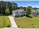 Charming two-story home with a well-maintained lawn, showcasing its curb appeal at 148 Spring Grove Dr, Mooresville, NC 28117